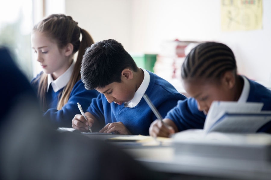 kids writing in a classroom